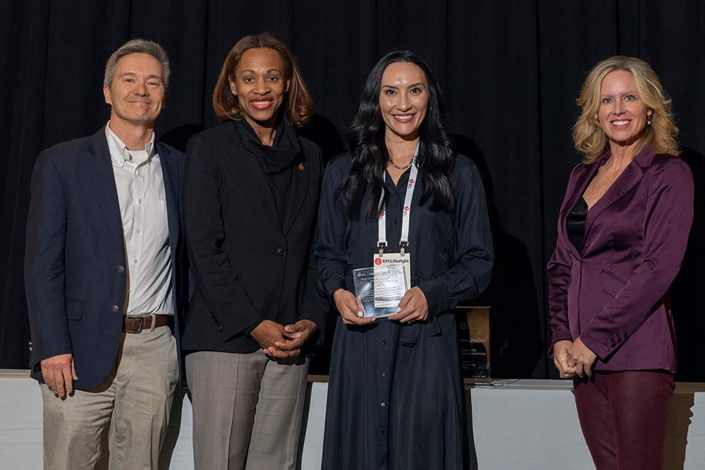 Tori Taniguchi receiving the Most Impactful Food is Medicine Research Award during EPI|Lifestyle26 in Boston, Massachusetts.