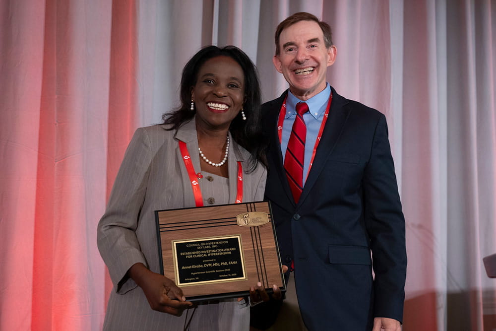 Annet Kirabo, DVM, MSc, Ph.D., FAHA, receiving the Established Investigator Award for Clinical Hypertension at Hypertension 2026 in Arlington, Virginia.