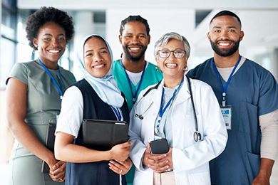 Portrait of diverse men and woman happy team of doctors
