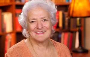 Headshot of Suzanne Oparil in orange top