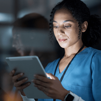Female health care professional on ipad