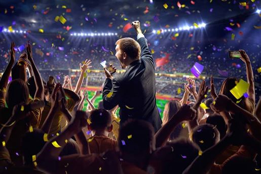 man cheering at sports event