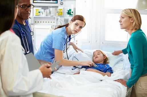 mother and daughter with staff in intensive care unit