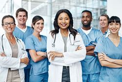 Group of doctors standing with hands crossed